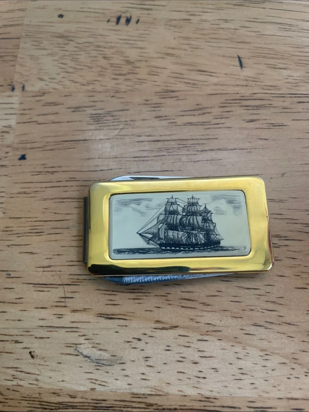 Gold-Tone Ship Engraved Money Clip with knife and file.